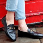 Gucci black loafers with gold clasp