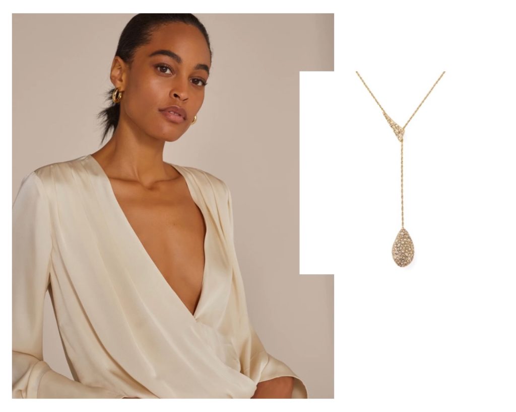 cream v-neck blouse with diamond necklace