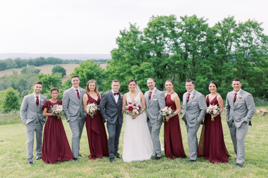 bride and groom with groosmen and bridesmaids, wearing grey suits and maroon dresses for Timeless Wedding AYS blog