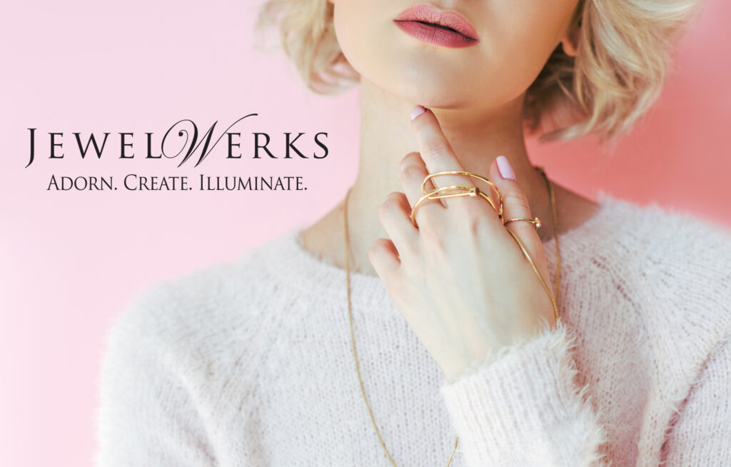 jewelwerks ad with blonde woman holding jewelry in hand and around neck brand photoshoot