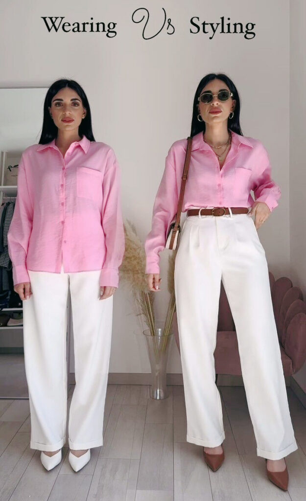 Two women wearing pink button-down shirts and white wide-leg pants. The woman on the left wears white pointed heels, while the woman on the right wears brown pointed heels, a brown belt, and sunglasses.